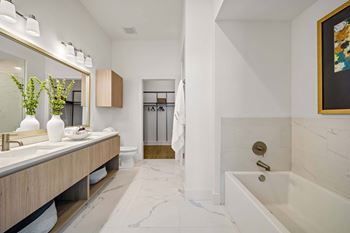 Dual vanities and oversized custom closets*